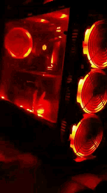 a computer case with a lot of red lights and fans