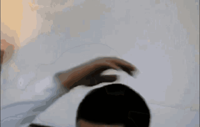 a blurry picture of a man with a white shirt