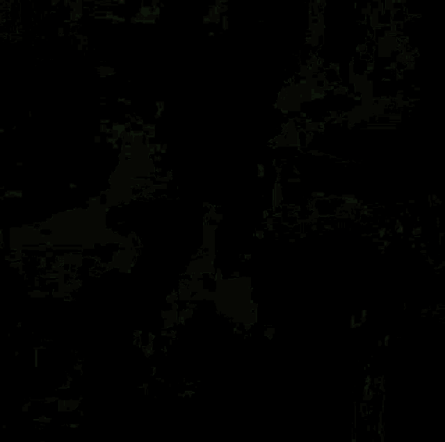 a dark background with a few red spots