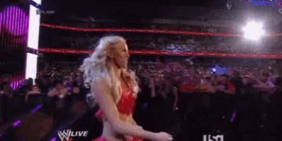 a woman in a red dress is dancing in front of a crowd and the words wlive are visible
