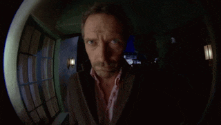 a fisheye view of a man 's face with a surprised expression
