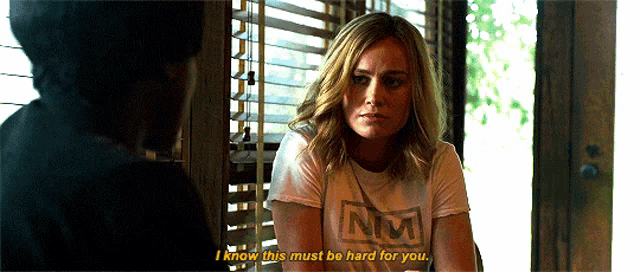 a woman wearing a t-shirt that says nm on it