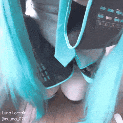 a woman with blue hair is kneeling down with the name luna lorraine on the bottom