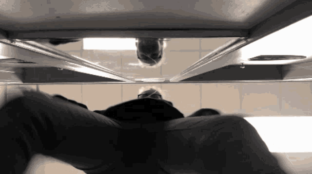 a reflection of a person 's head is visible in a mirror