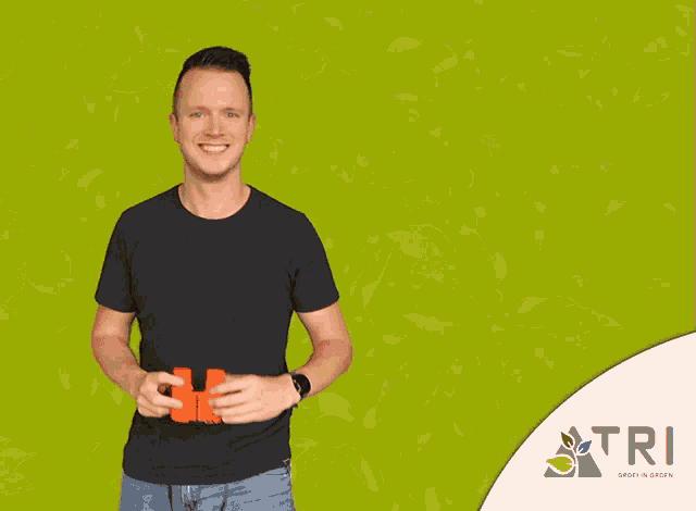 a man looks through binoculars in front of a green background with the word tri on it