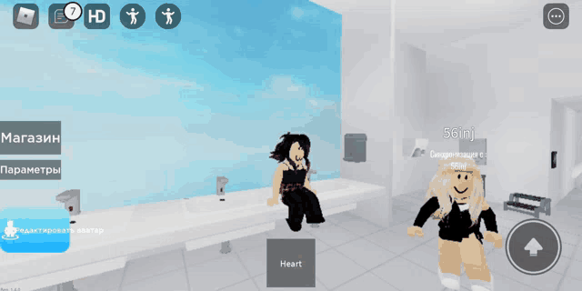 a screenshot of a video game shows a girl sitting on a counter and another girl standing in a bathroom