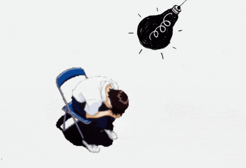 a person kneeling down next to a light bulb