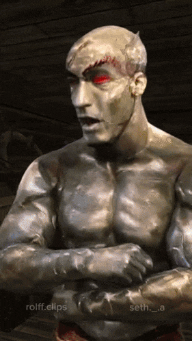 a statue of a man with red eyes and the words rolff.clips on the bottom right