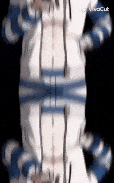 a person in a blue and white striped shirt is standing in front of a black background in a kaleidoscope .