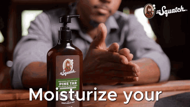 a man sitting at a table with a bottle of pine tar moisturizer