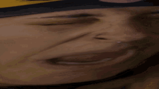 a close up of a person wearing a mask
