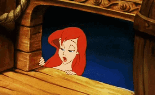 a cartoon of a mermaid looking out a window