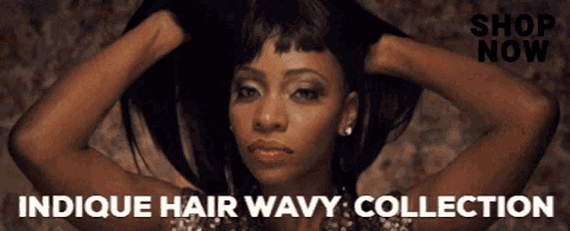a woman with her hands in her hair and the words indique hair wavy collection below her