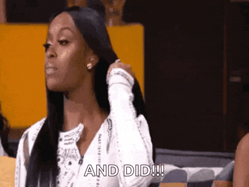 a woman is sitting on a couch with her hand on her hair and the words " and did " written on the bottom