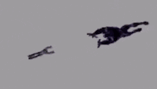 a man in a hoodie is being attacked by a monster in a cartoon .