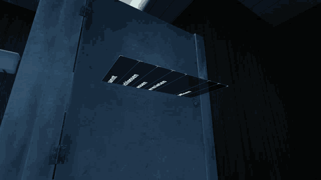 a dark room with a few pieces of paper on the wall that says ' a ' on it