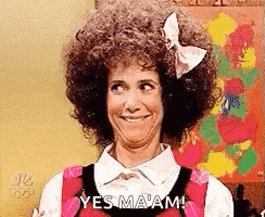 a woman with an afro and a bow in her hair is smiling and saying `` yes ma am '' .