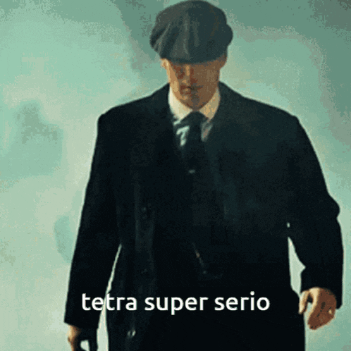 a man in a suit and tie is walking with the words tetra super serio written on the bottom