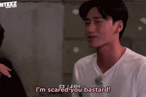 a man in a white shirt is saying i 'm scared you bastard .