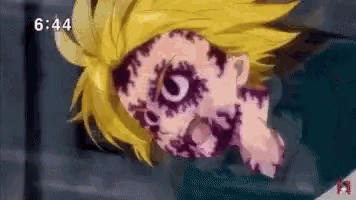 a close up of a person 's face with a clock on the bottom right corner .