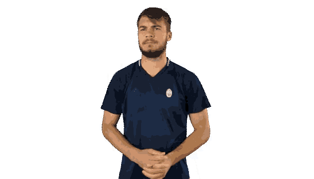 a man wearing a blue adidas shirt is making a gesture