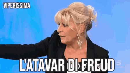 a woman in a black suit says l' atavari di freud