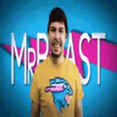 a man wearing a yellow shirt with a mrbeast logo