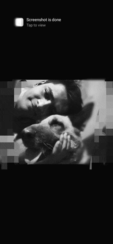 a black and white photo of a man hugging a dog with the words screenshot is done tap to view at the bottom