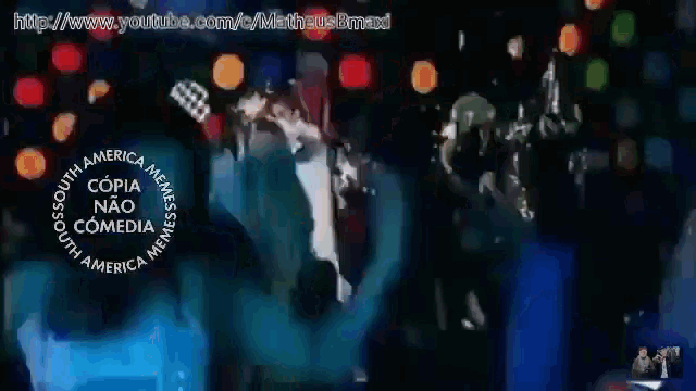 a group of people dancing in front of a sign that says copia nao comedia