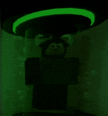 a monkey with horns is glowing in the dark with a green light behind it