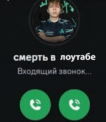 a man in a blue shirt is talking on a phone in russian .