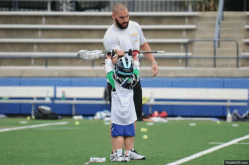 Lacrosse Coach Lifts Up Kid Holding Lacrosse Stick GIF - Lacrosse Lacrosse Camp Strong GIFs