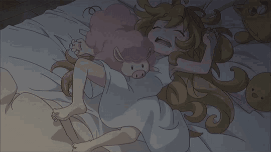 a girl is laying in bed with a stuffed pig on her chest