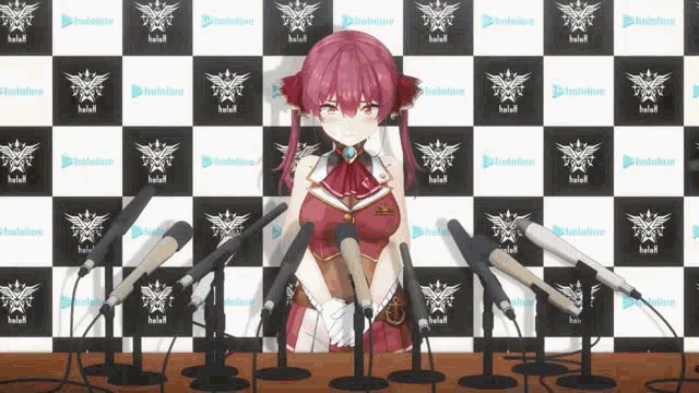 a girl stands in front of a wall with hololive logos on it