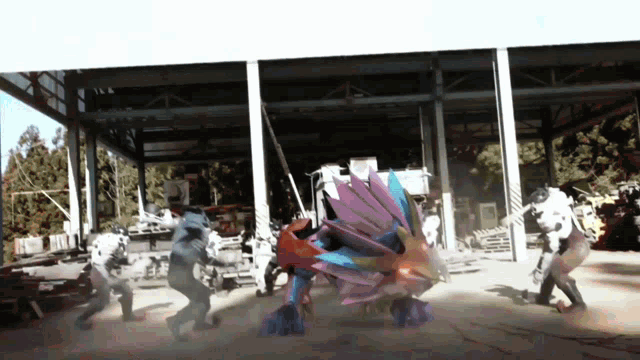 a group of people are standing in front of a building with a robot in the background
