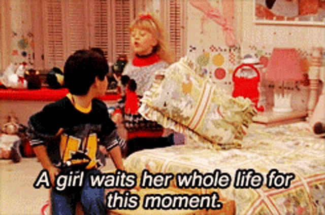 a girl waits her whole life for this moment while sitting on a bed