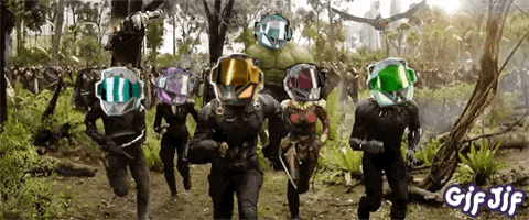 a group of people with helmets on their heads are running through a forest with gif jif written below them