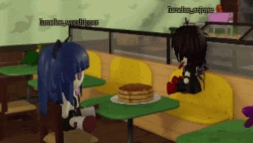 two cartoon characters are sitting at a table with a plate of pancakes on it