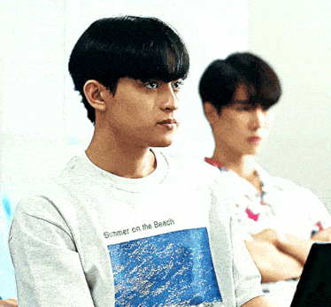 a man wearing a summer on the beach shirt