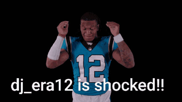 a football player in a blue jersey with the number 12 on it