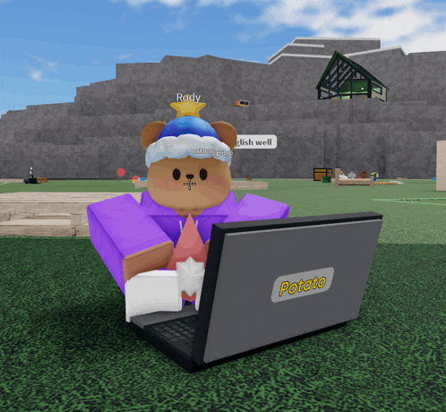 a cartoon character sitting in front of a laptop that says potato