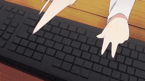 a person is typing on a black keyboard with their fingers .