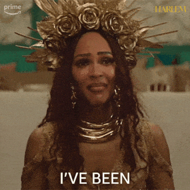 a woman wearing a gold crown and necklace says " i 've been "