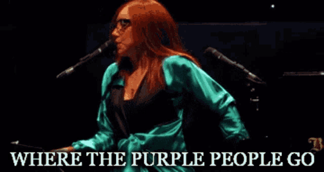 a woman singing into a microphone with the words " where the purple people go " above her