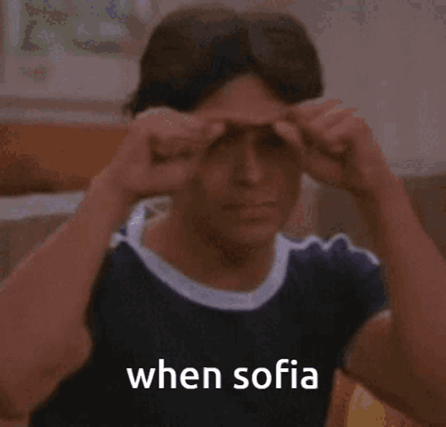 a man making a funny face with the words " when sofia " written below him