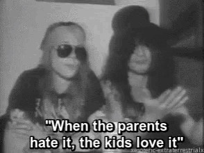 a black and white photo of two people with the caption " when the parents hate it , the kids love it " .