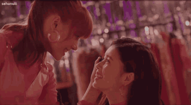 two women are looking at each other with sehunult written in the upper right corner