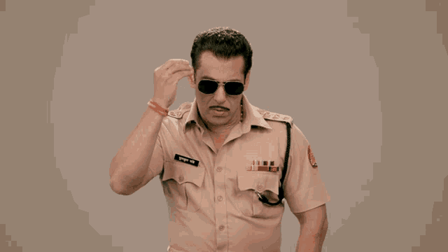 a man in a police uniform has the word faadu written on his shirt