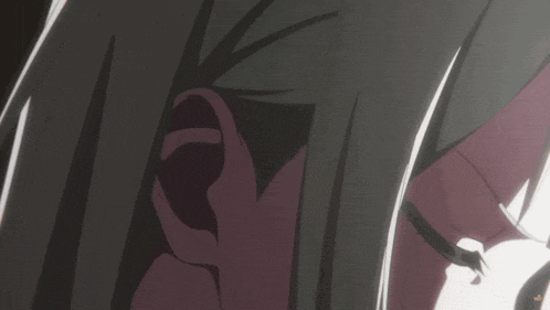 a close up of a person 's ear with a purple background