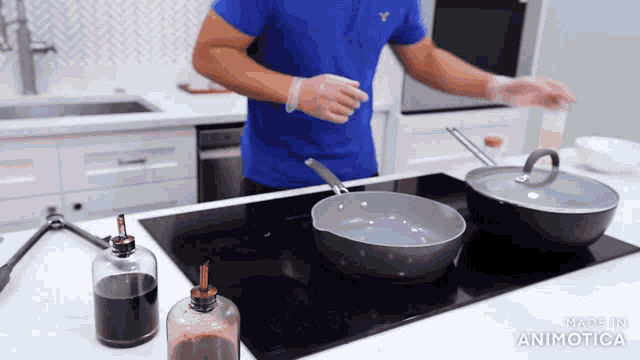 a man in a blue shirt is cooking on a stove with the words made in animatica on the bottom right